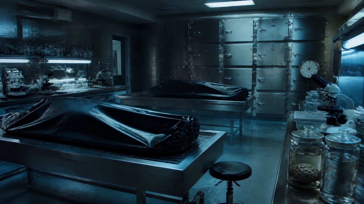 The Forensic Lab — Steel tables, body bags, the giant glass jars as evidence, microscopes, the blue-white hum. Where Neha reads the dead — including her own kills.