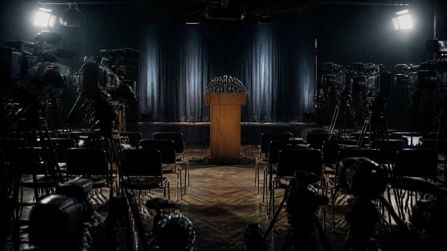 The Press Conference — The media glare that haunts every move — the case lived out in public, under flashbulbs.