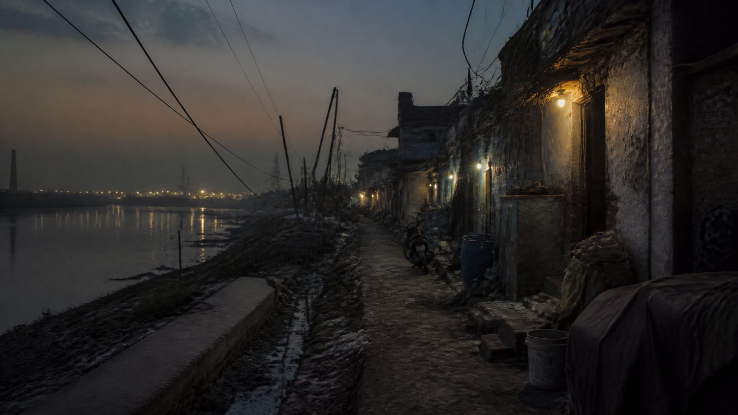 Soniya Vihar — The foul-smelling riverside lane the team finally traces — phytoplankton on the jars leading them to the water’s edge.